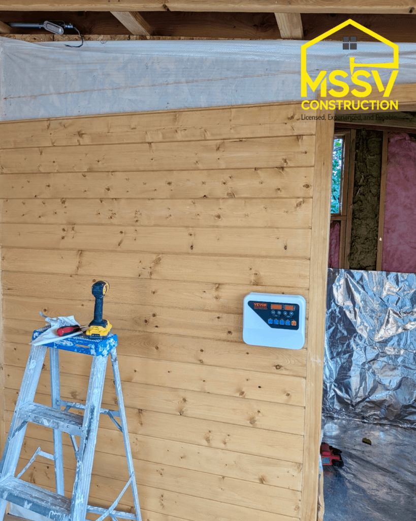 Cedar sauna interior with digital control panel installed during construction