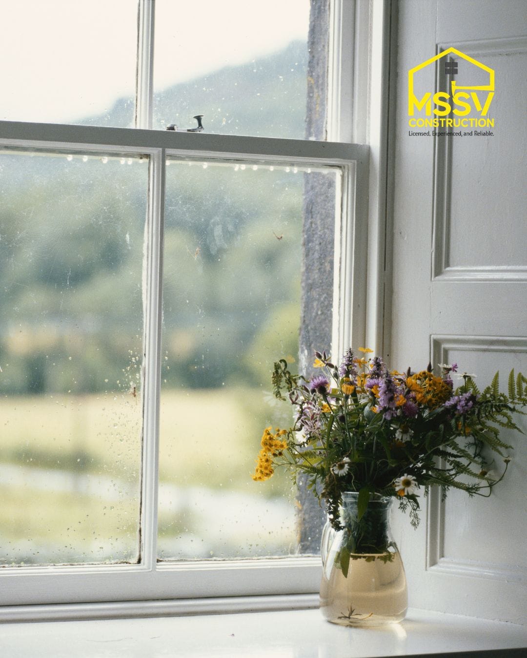Bright replacement window with flower vase by MSSV Construction