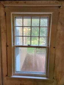 Old wood-framed window during a home renovation project